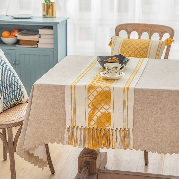 Handwoven cotton table runner with geometric center stripe and fringes