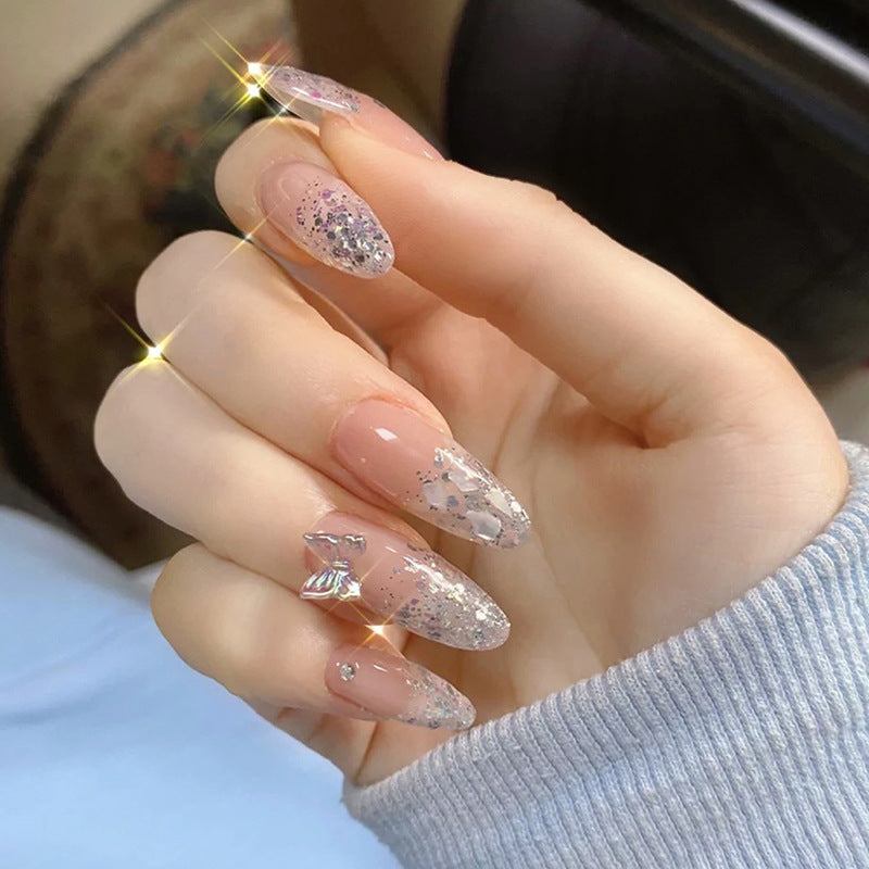 Glittering stiletto nails with elegant decorations Stornfield