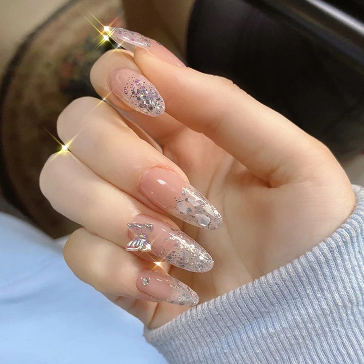 Glittering stiletto nails with elegant decorations Stornfield