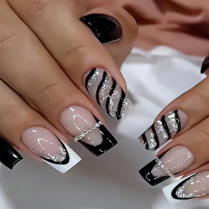Elegant artificial nails with glitter and stripe accents Stornfield