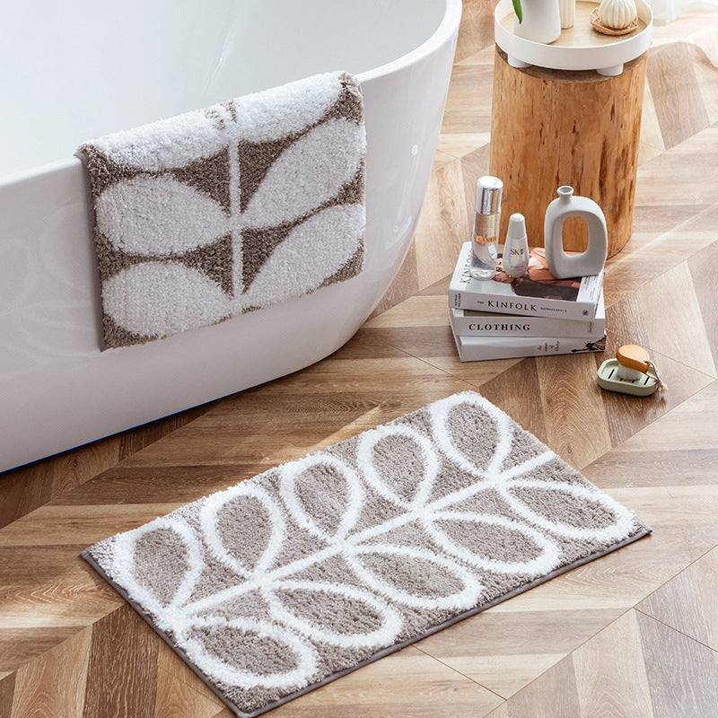 Fluffy bath mat in a graphic wave relief with anti-slip base Stornfield