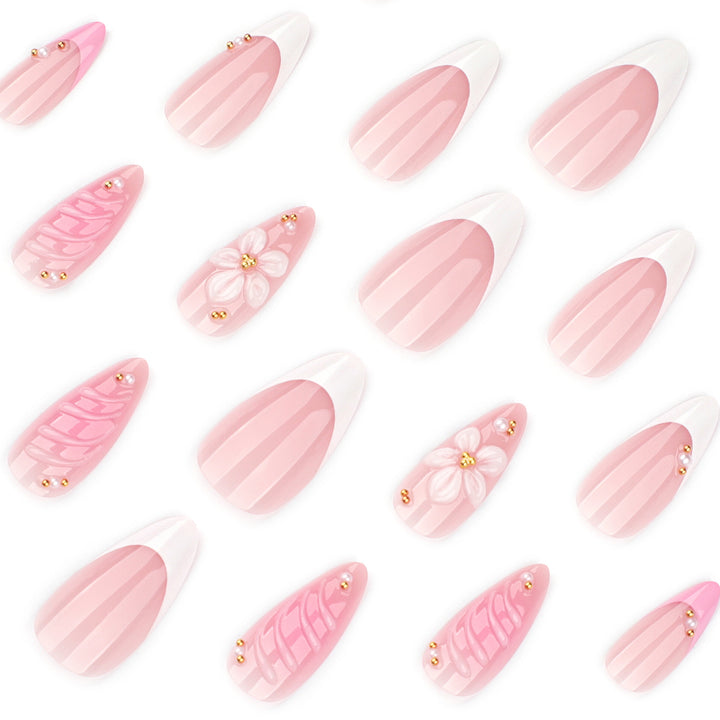 Artificial nail art with floral design and glitter accents Stornfield