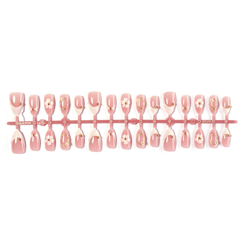 Artificial nail set with elegant flower and glitter accents Stornfield