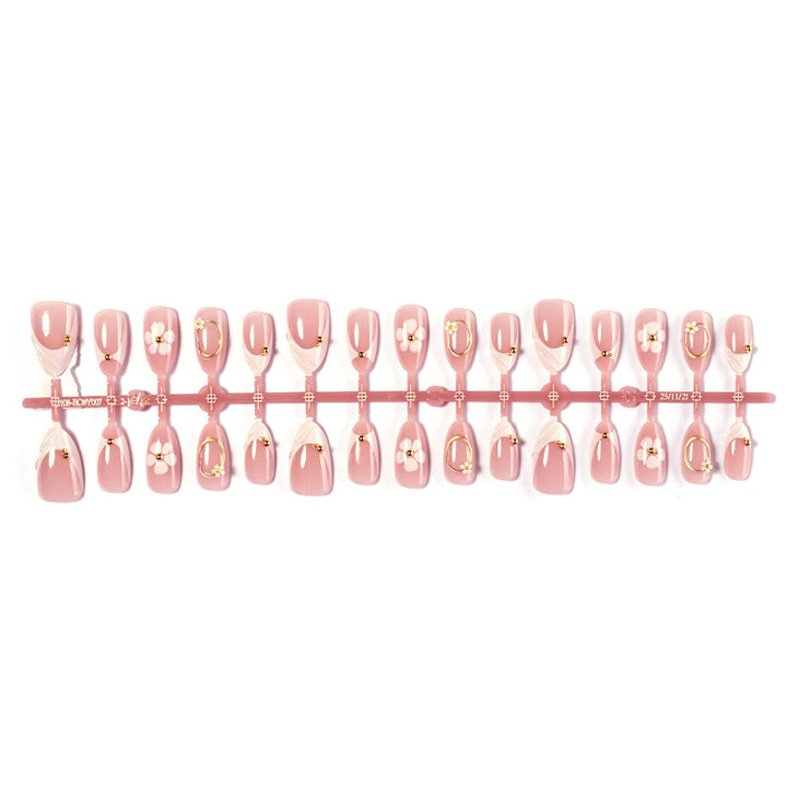 Artificial nail set with elegant flower and glitter accents Stornfield