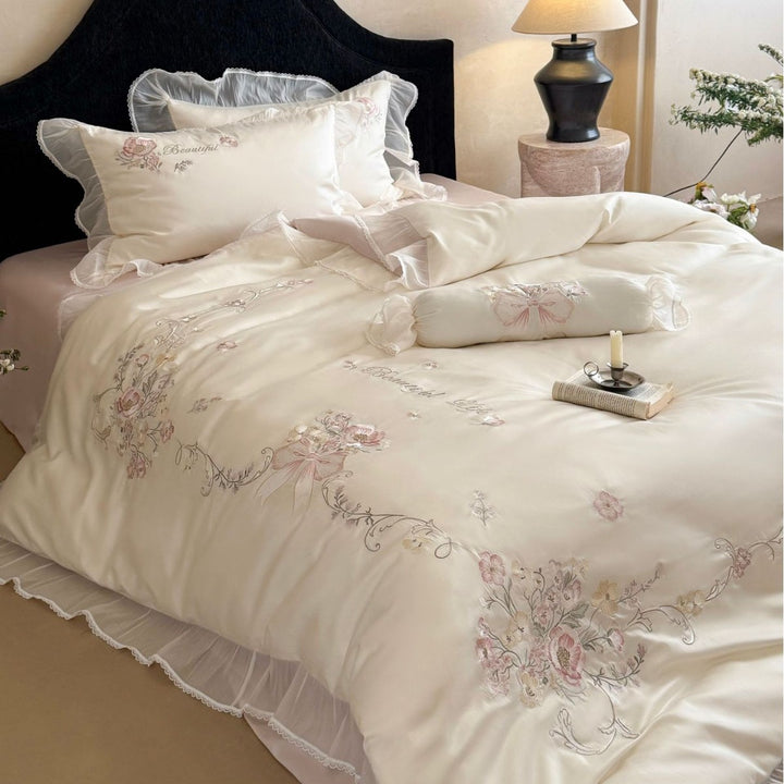 Embroidered satin bedding set with frill, ruffles, and decorative pillow