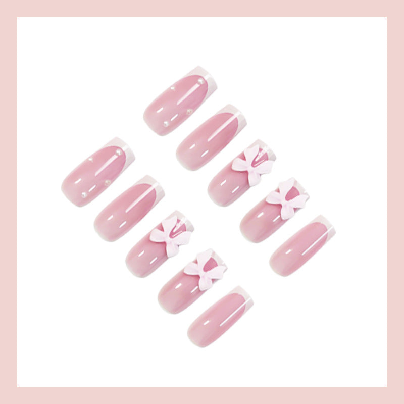 Glamorous artificial nail set with elegant bows and glitter accents Stornfield