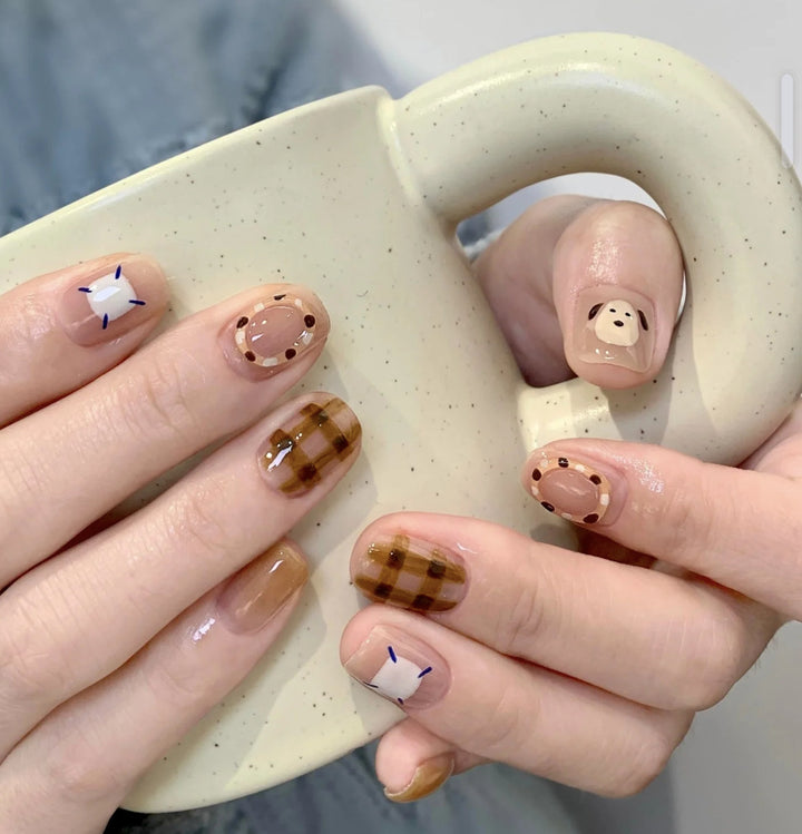 Playful artificial nails with cute animal and pattern accents Stornfield