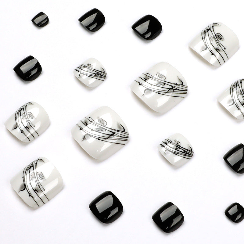 Artful toenail art in elegant black and white design Stornfield