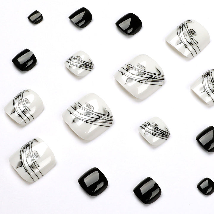 Artful toenail art in elegant black and white design Stornfield