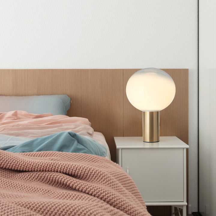 Modern Artistic Table Lamp with Sleek Metallic Base and Globe Shade