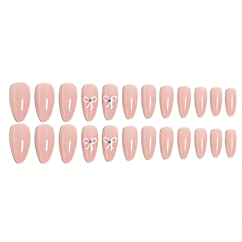Artificia nails with delicate bow accents Stornfield