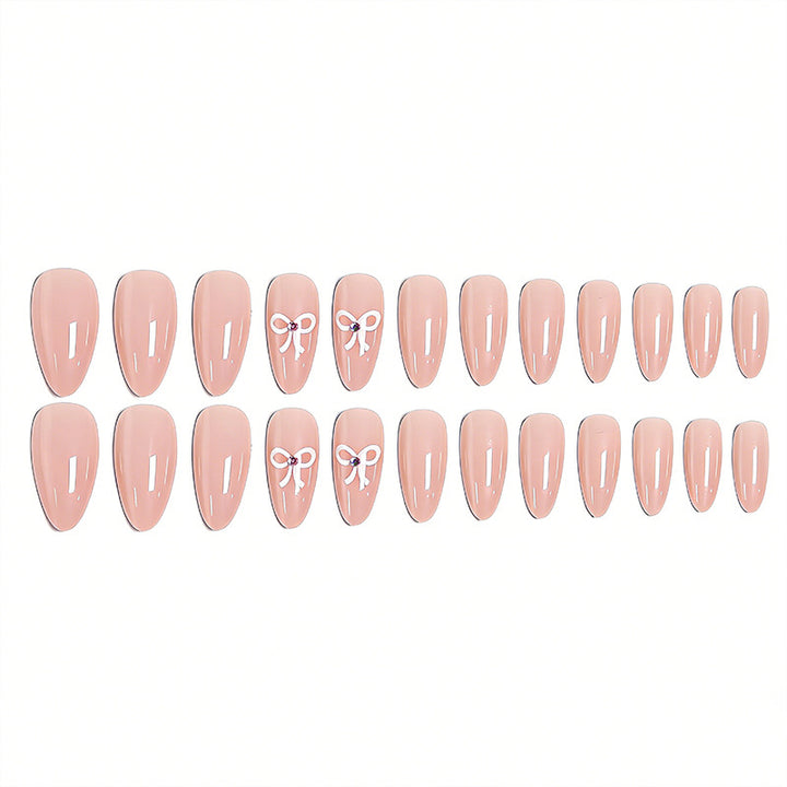 Artificia nails with delicate bow accents Stornfield