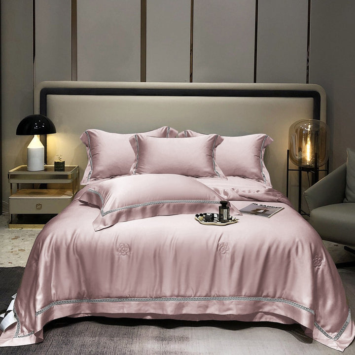 Luxurious satin bedding set with fine embroidered border and tone-on-tone floral relief