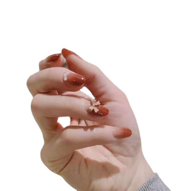Artificial nails with glamorous bow and pearl decor Stornfield