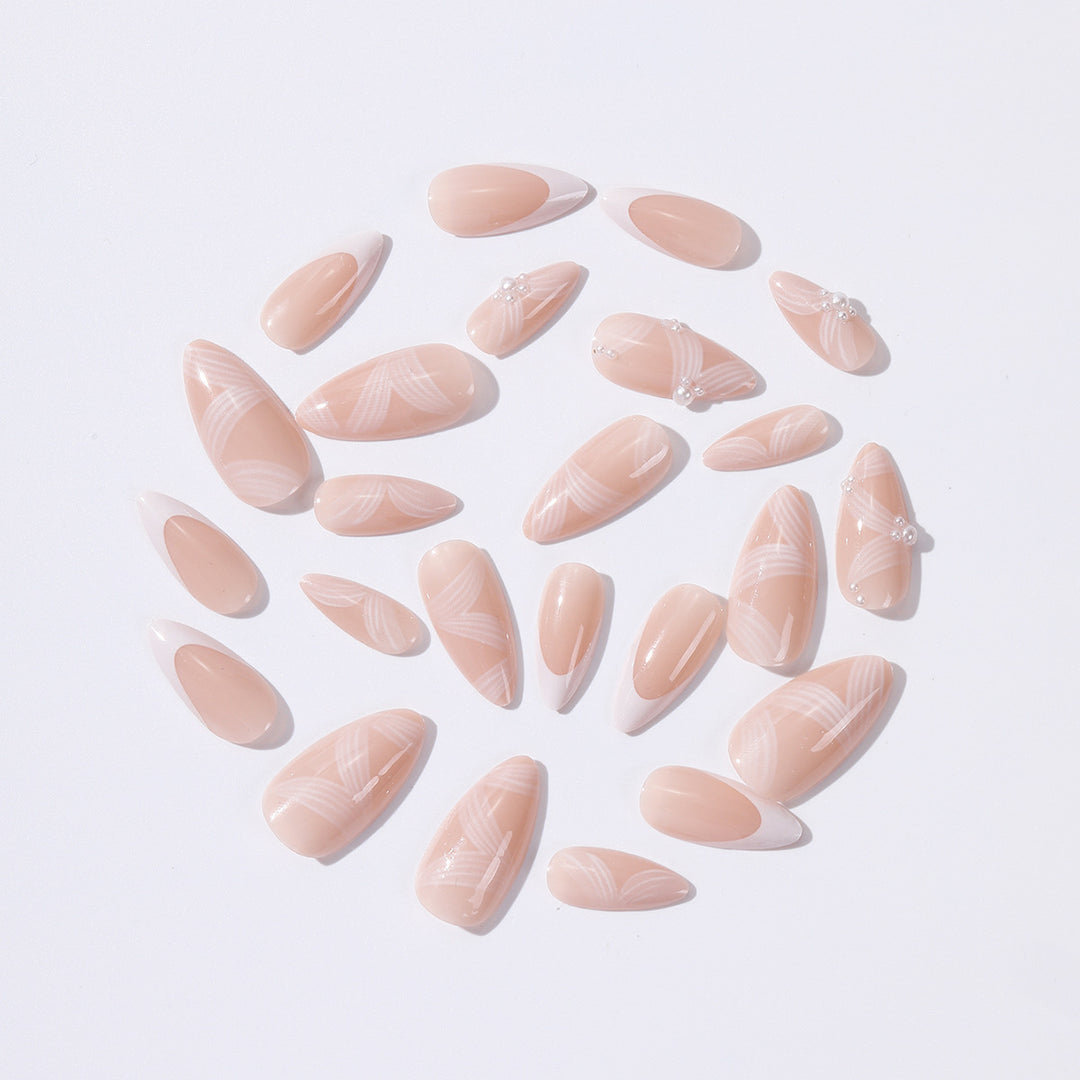 Creative acrylic nail set with elegant tips and glitter decorations Stornfield