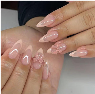 Artificial nail set with elegant tips and romantic bow decorations Stornfield