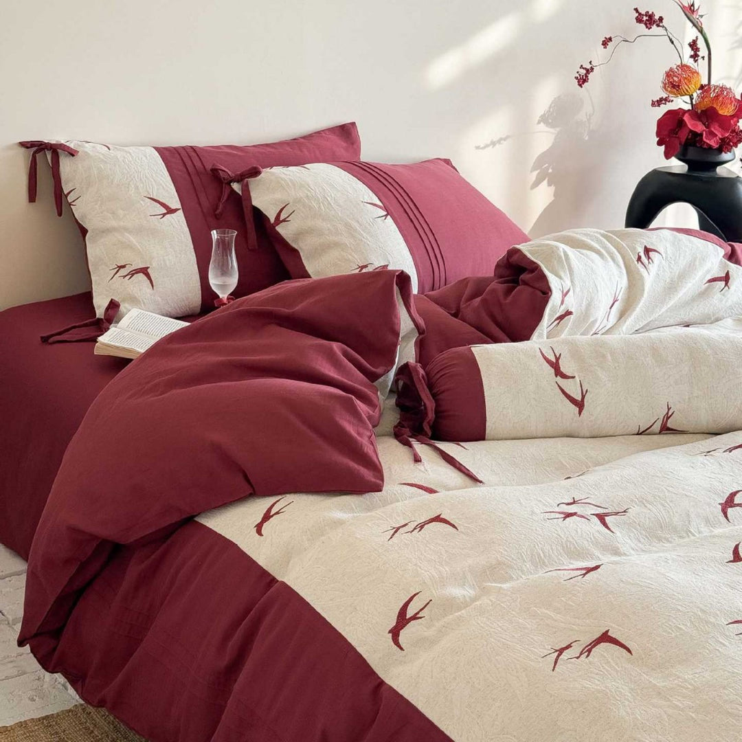 Luxurious cotton bedding set with swallow embroidery and bow accents