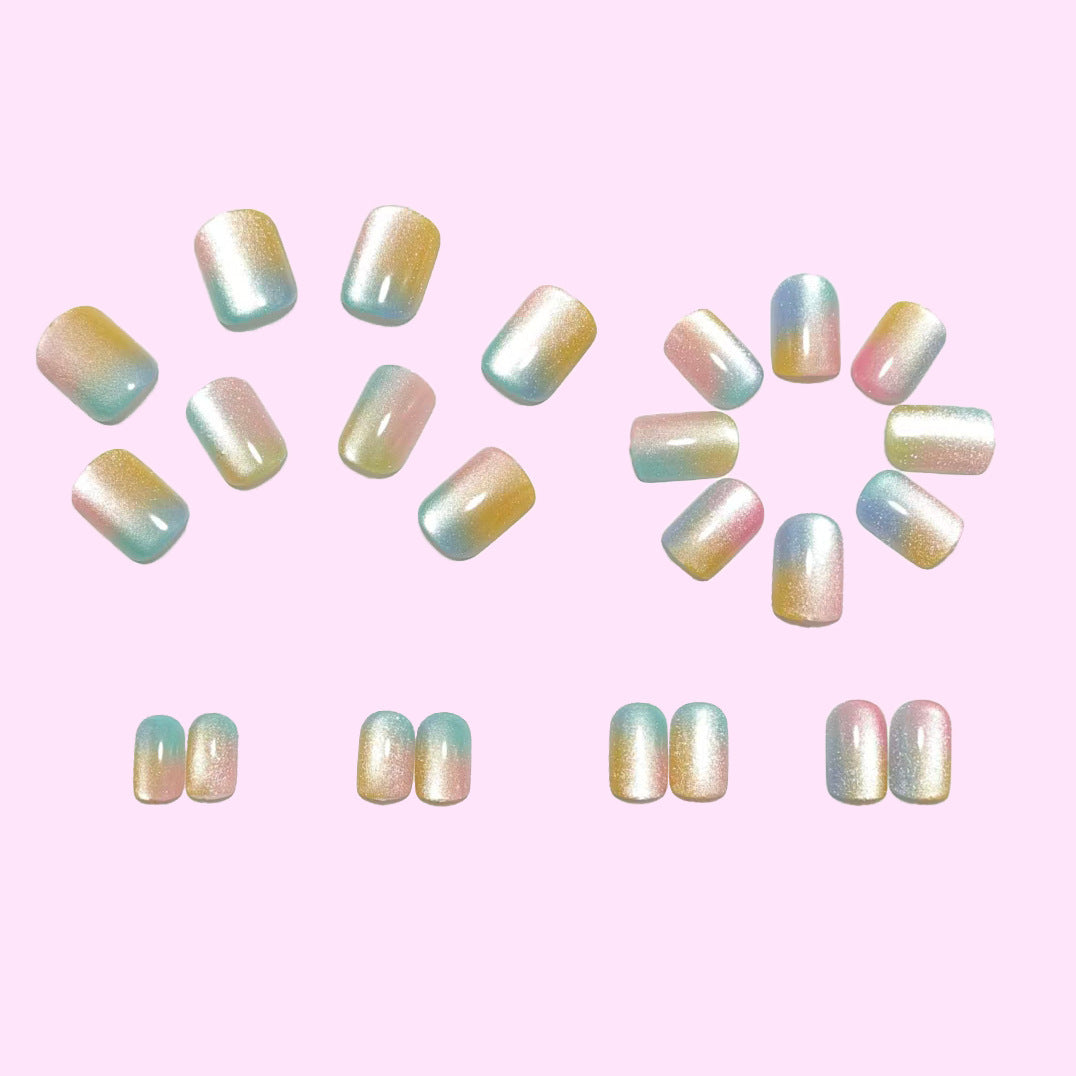 Artificial nails in delicate ombre design with glitter effects Stornfield