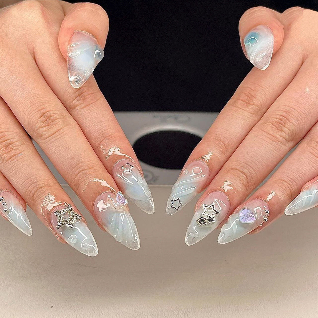 Artistic 3D Nail Extensions with Colorful Designs and Glitter Accents Stornfield