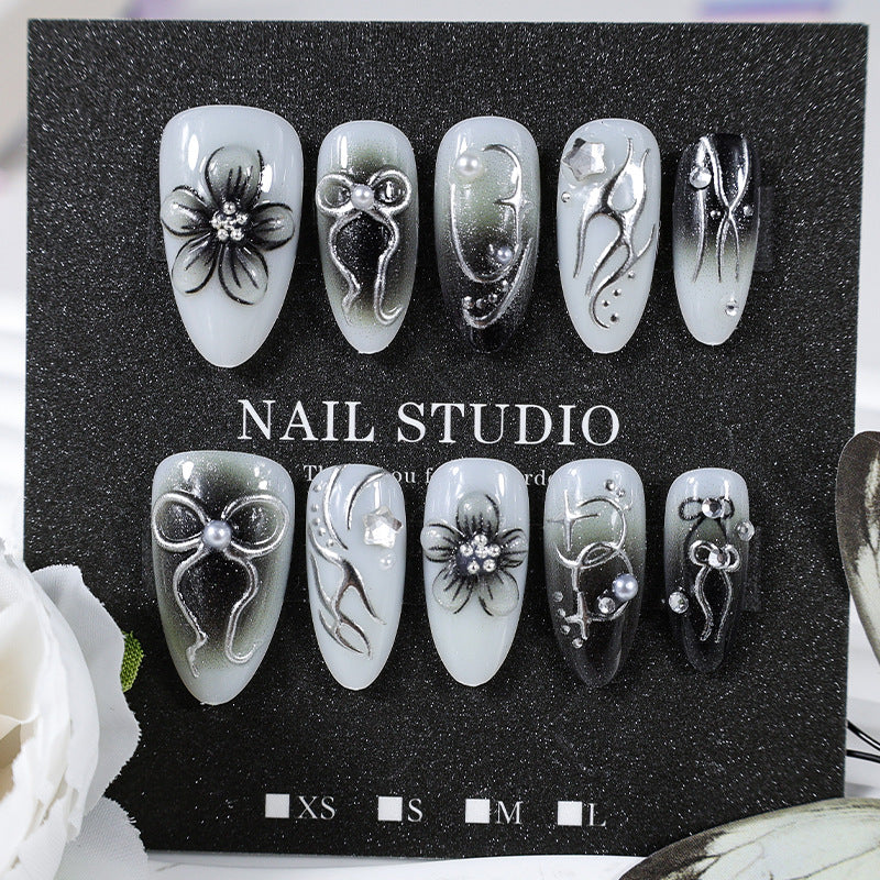 Artificial nails with elegant floral and glittering decorations Stornfield
