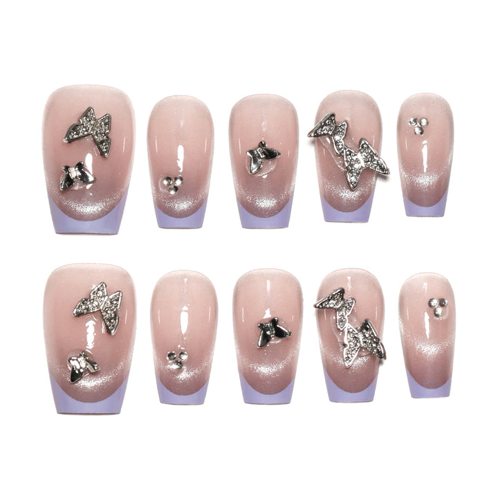 Artificial nail extensions with glitter design and elegant accents Stornfield