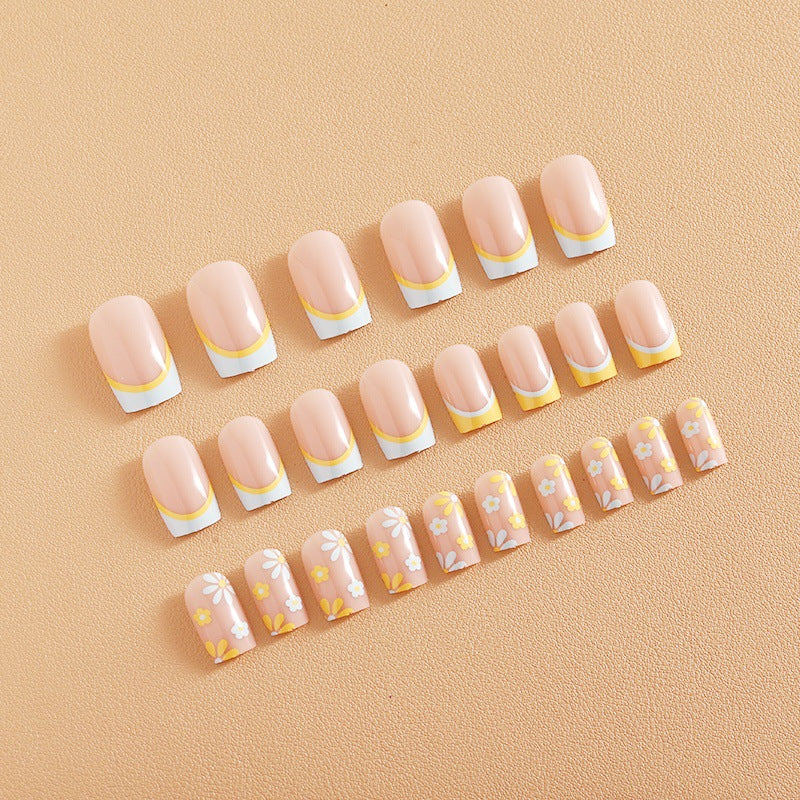 Nail art set with creative floral designs and elegant French finish Stornfield