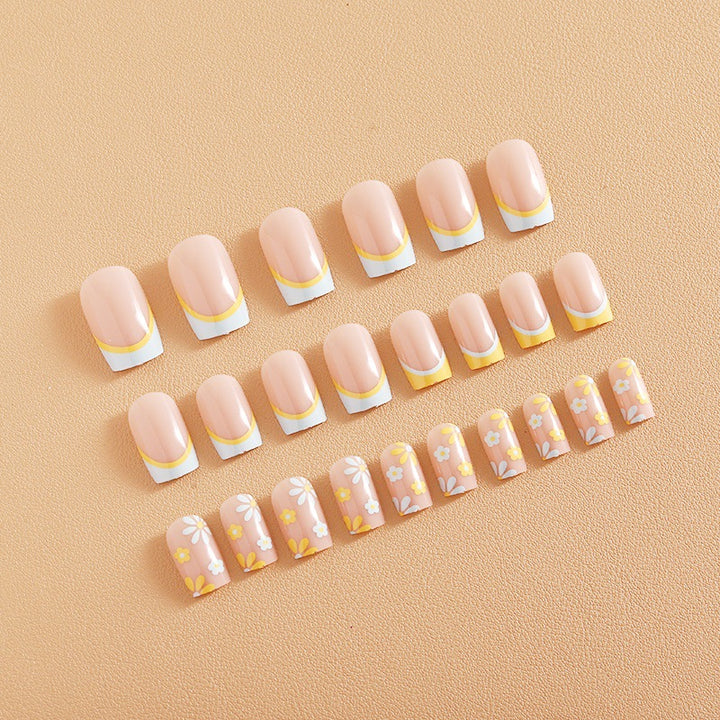Nail art set with creative floral designs and elegant French finish Stornfield