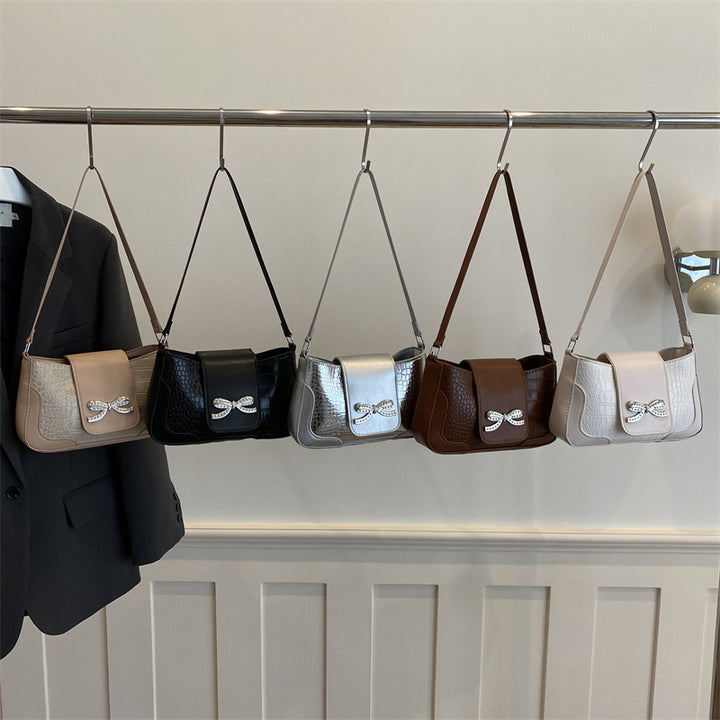 Elegant Crocodile-Patterned Handbag with Bow Detail