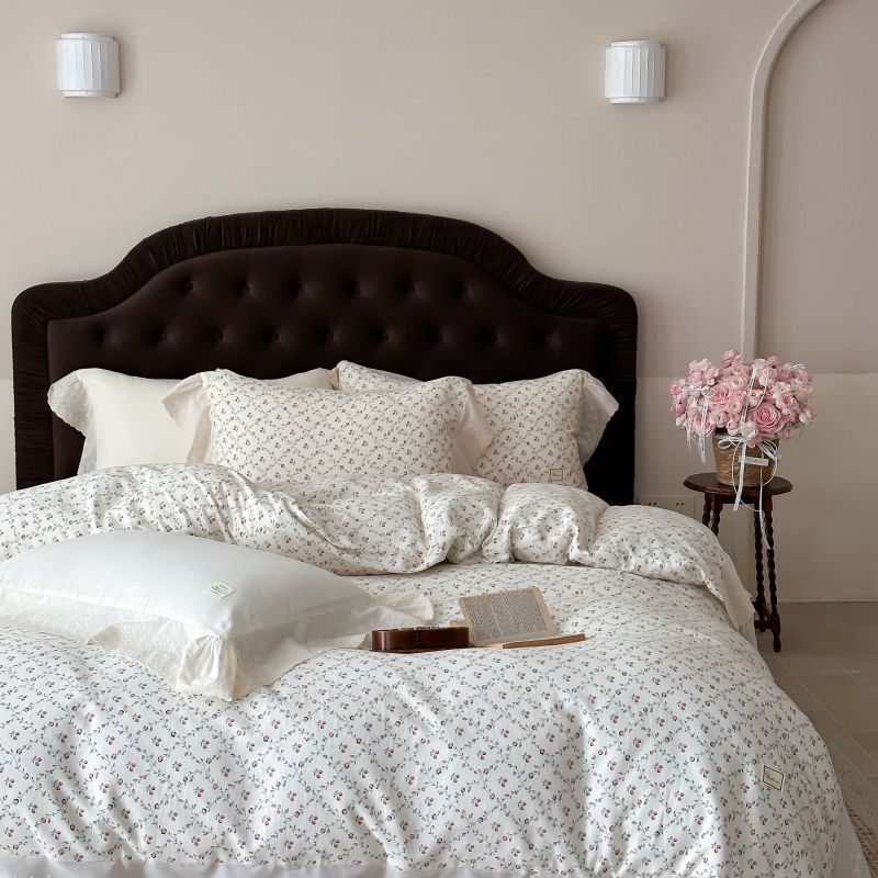 Luxurious cotton satin bed linen set in vintage style with delicate floral pattern and lace trim