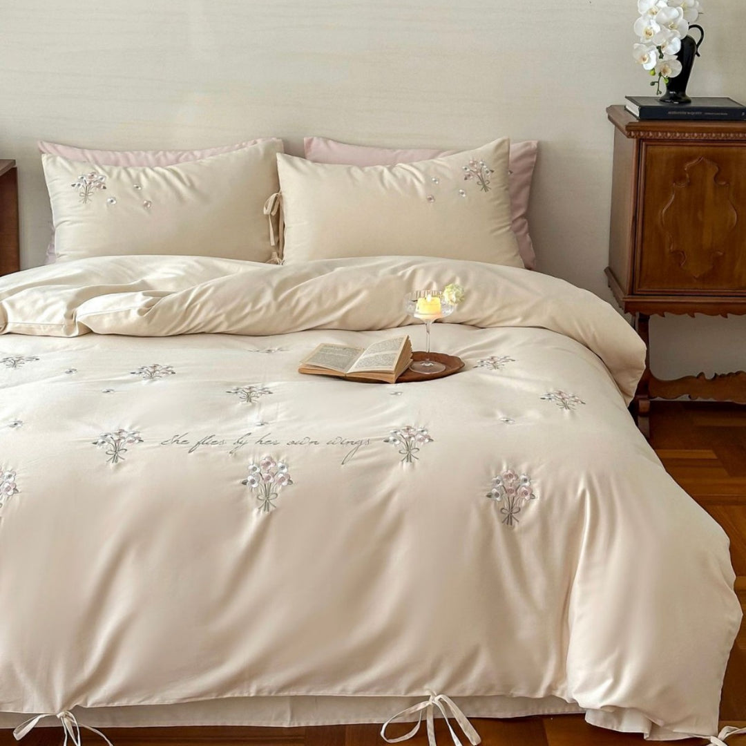 Luxurious satin bedding set with delicate pearl flower embroidery and tie ribbons