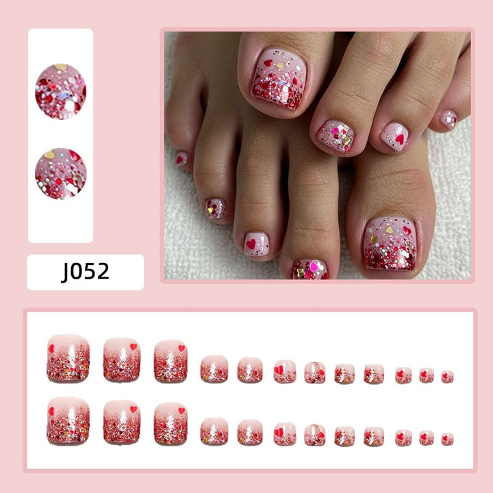 Artificial nails with glitter and heart pattern Stornfield