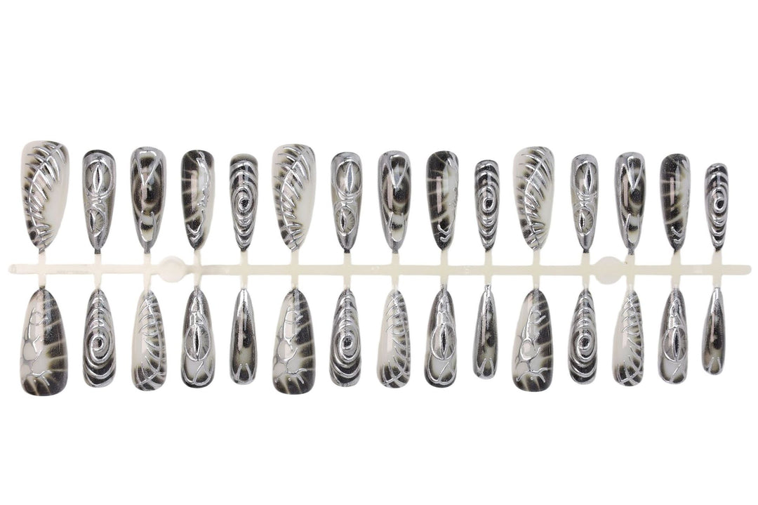 Artificial nail set with modern spiral pattern and shiny accents Stornfield