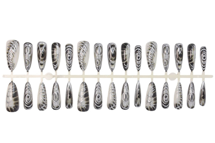 Artificial nail set with modern spiral pattern and shiny accents Stornfield