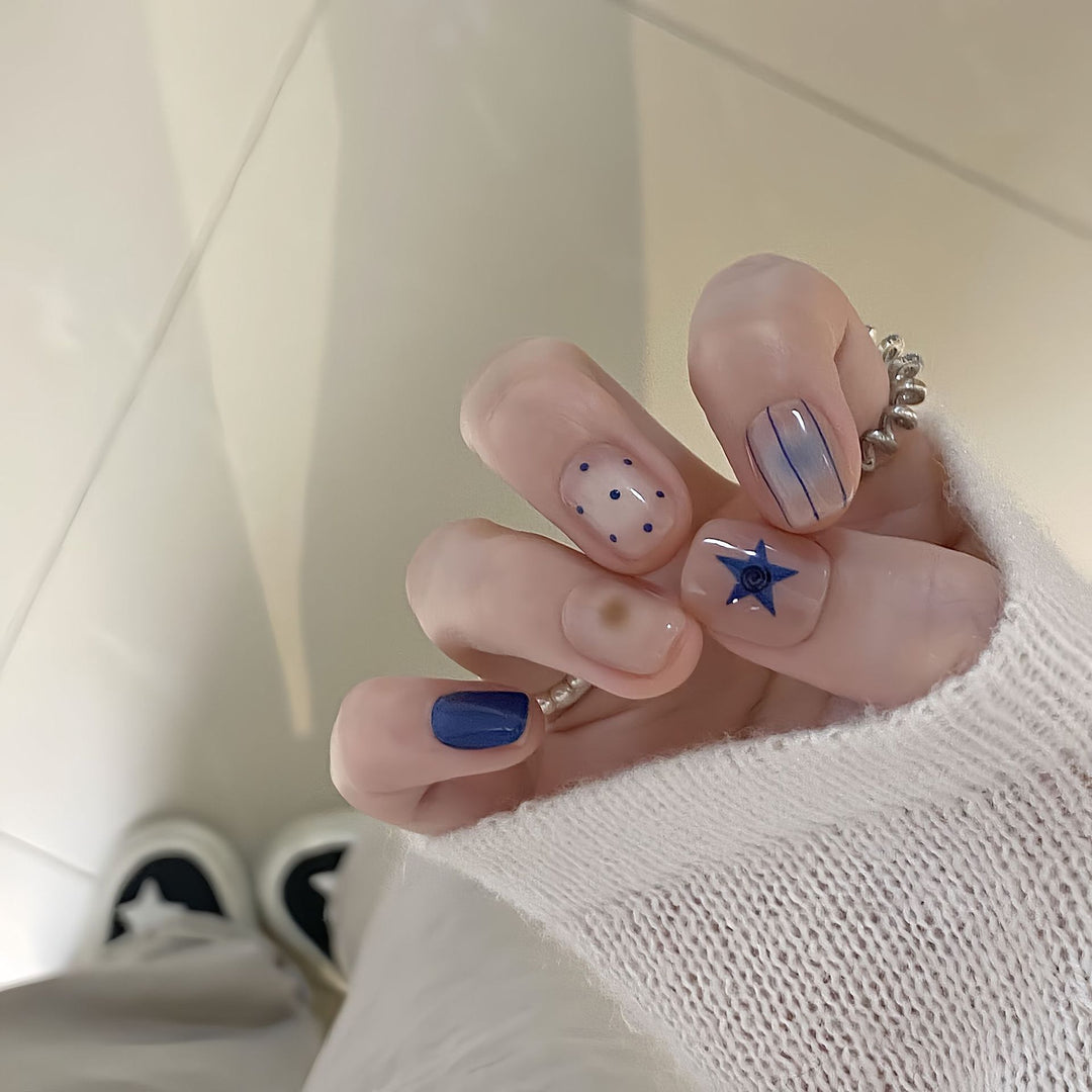 Artificial nails in modern design with geometric and sparkling accents Stornfield