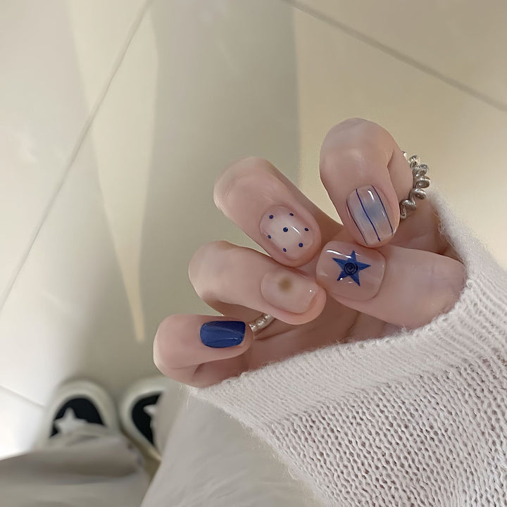 Artificial nails in modern design with geometric and sparkling accents Stornfield