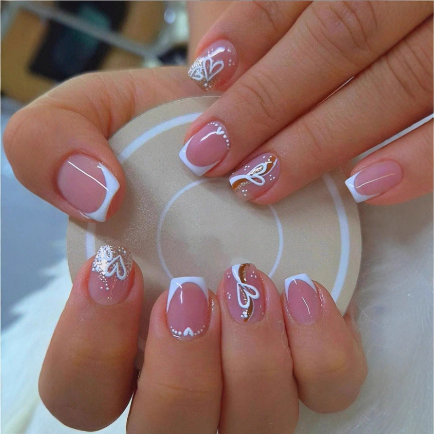 Elegant Heart-Embellished Nail Art Design Stornfield