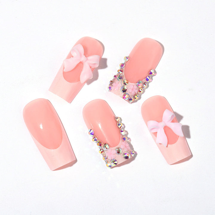 Artifical nail set with glamorous 3D bows and crystal embellishments Stornfield