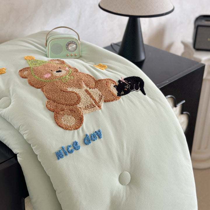 Children's bedding with tufted rabbit appliqué