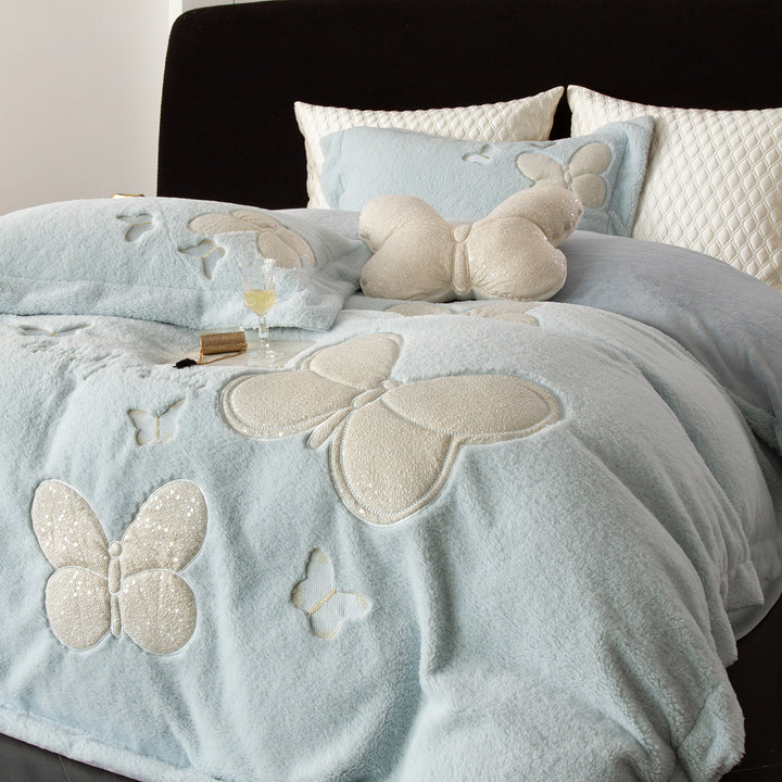 Cozy bedding and throw blanket set with applied butterfly appliqués and velvety microfleece look