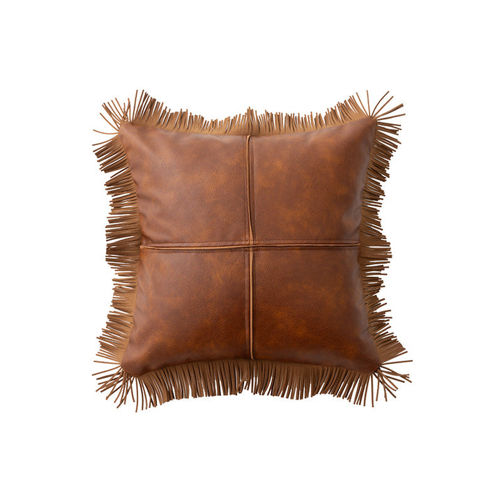 Decorative faux leather cushion with fringes and decorative seam