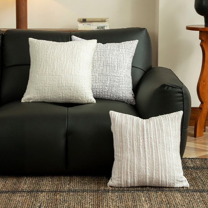 Square, quilted decorative pillow with woven texture Stornfield
