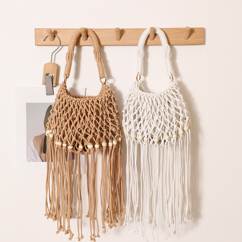 Macrame bag with decorative fringes and wooden beads Stornfield
