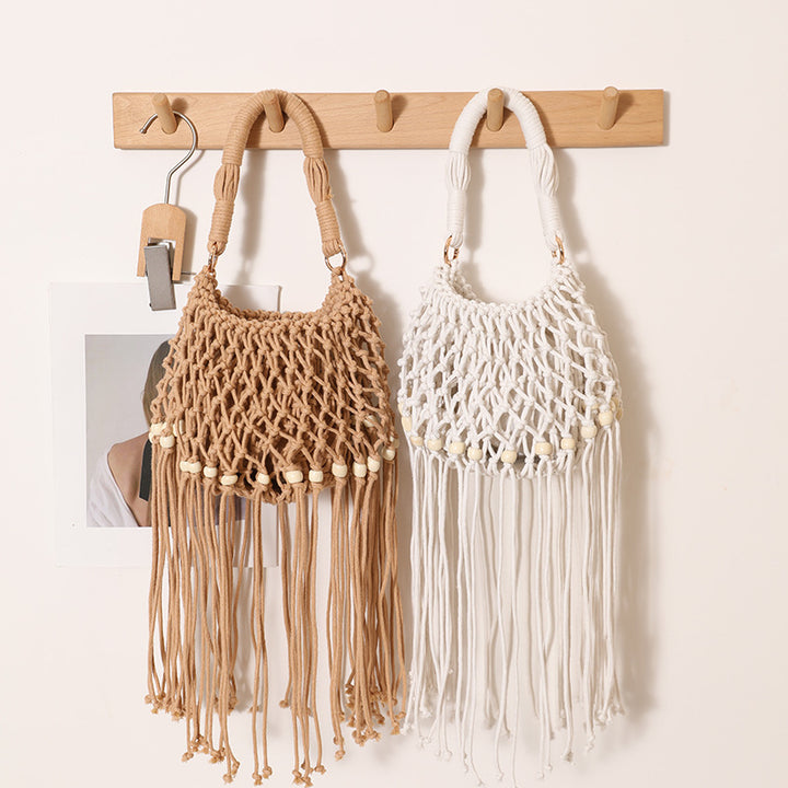 Macrame bag with decorative fringes and wooden beads Stornfield