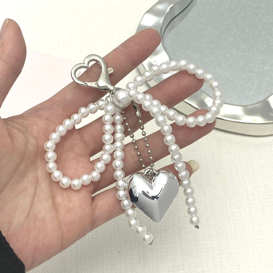 Elegant Pearl Bow Keychain Stornfield