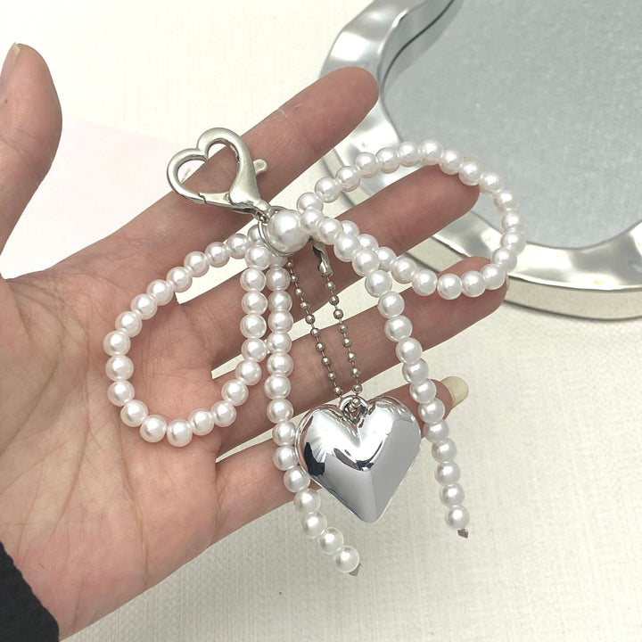 Elegant Pearl Bow Keychain Stornfield