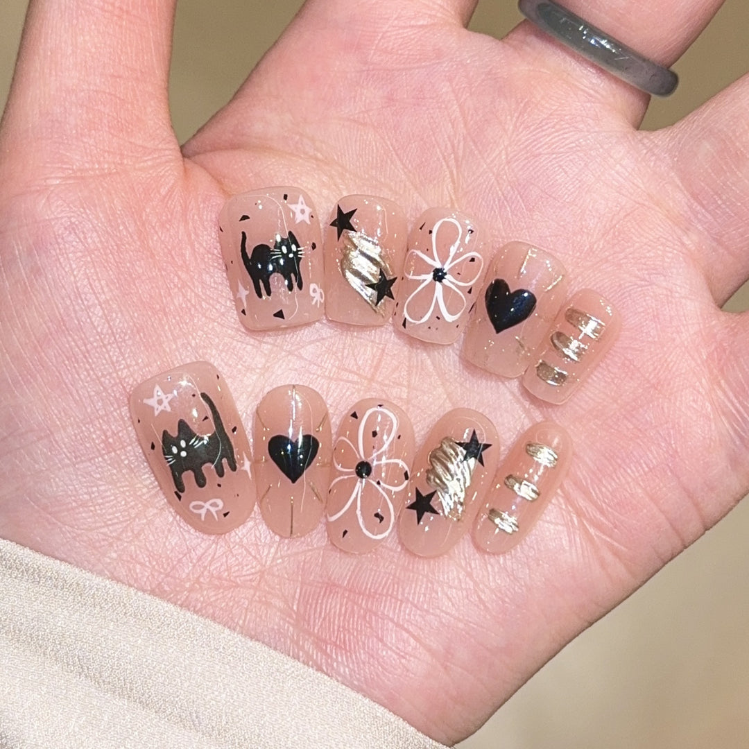 Artificial nails with unique cat and star design Stornfield