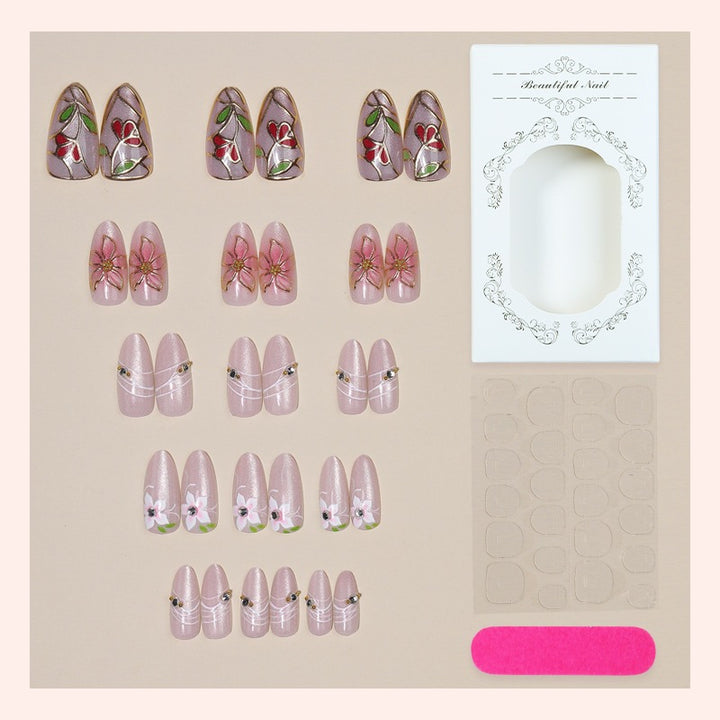 Artificial nail set with luxurious floral designs and glitter accents Stornfield