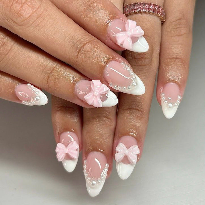 Artificial nail art with playful dots and bows Stornfield
