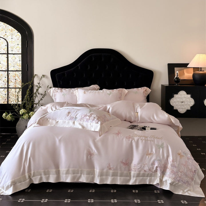 Luxurious satin bedding set with embroidered butterfly and flower appliqués