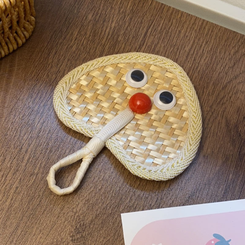 Handcrafted fan with playful face motif Stornfield